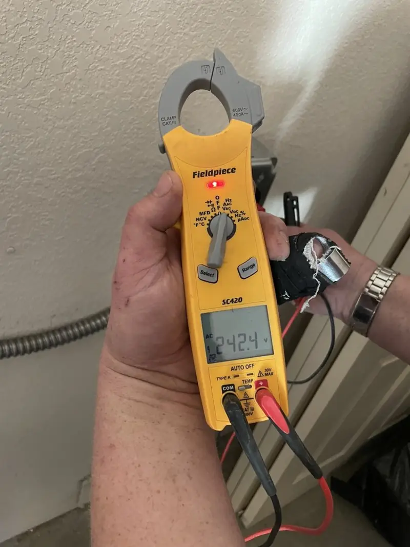 Voltage testing with clamp meter during Whole House Surge Protector in Sidney